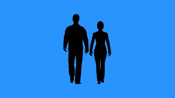 Couple walking together. Black silhouettes of man and woman walking on blue background. Relations between men and women concept.