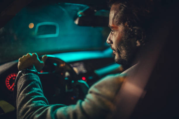 istock Man Driving A Car In Night 1138655268