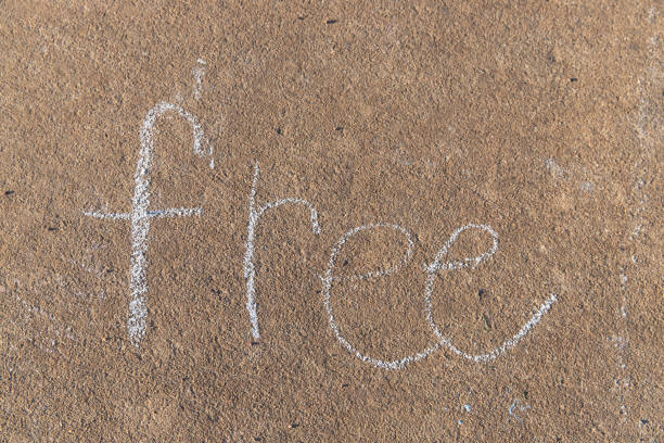 istock the word Free written with sidewalk chalk 1138655324