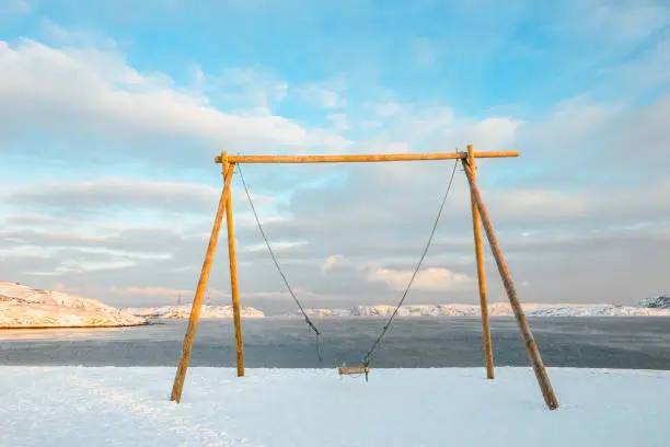 Photo of the popular huge swing on Arctic beach in Teriberka, Russia