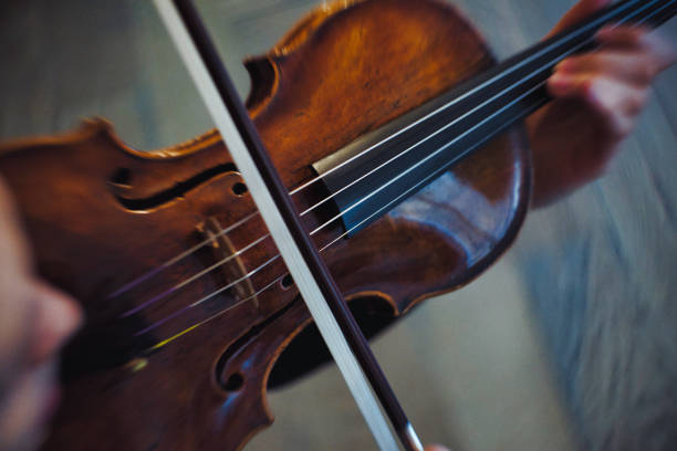 istock Young woman plays violin 1138659152