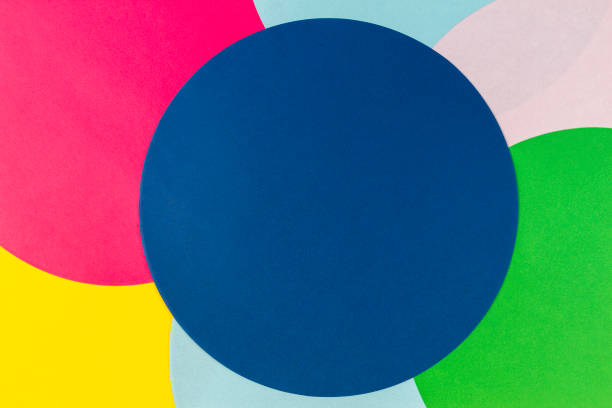 Abstract color paper background. Multicolored round circle shape geometry composition on light green background. Top view