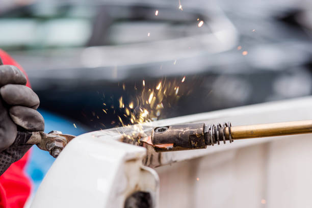 istock young worker repairing a car 1138659776