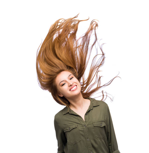 istock Young woman tossing her hair sideways 1138661788