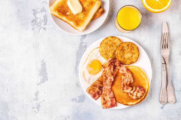 istock Healthy Full American Breakfast with Eggs Bacon Pancakes and Latkes 1138664211