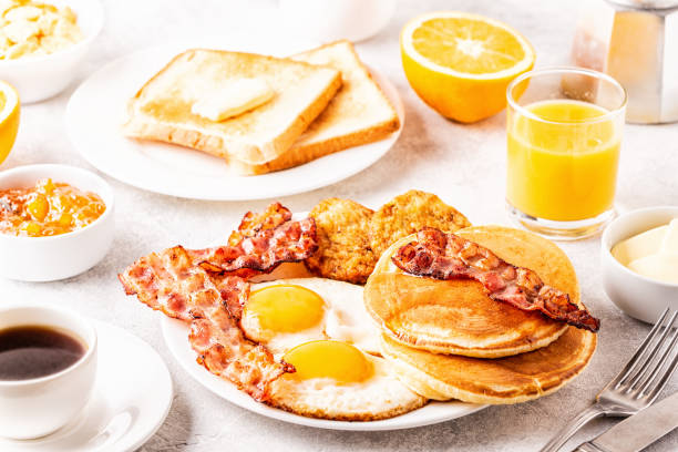 istock Healthy Full American Breakfast with Eggs Bacon Pancakes and Latkes 1138664236
