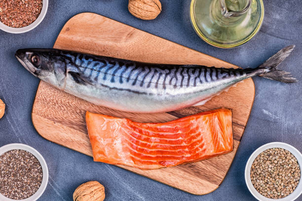 sources of omega 3 - mackerel, salmon, flax seeds, hemp seeds, chia, walnuts, flaxseed oil. - nutritional supplement salmon food flax imagens e fotografias de stock