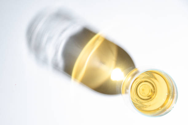 istock Juice in a glass and shadow on the table. Top view. 1138665177