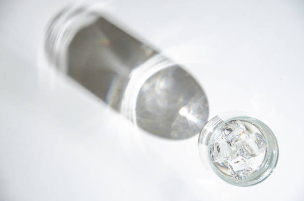 istock Water in a glass cup and shade on the table.  Top view. 1138665795