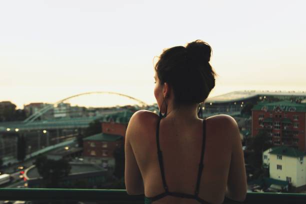 istock Girl and sunset 1138666226