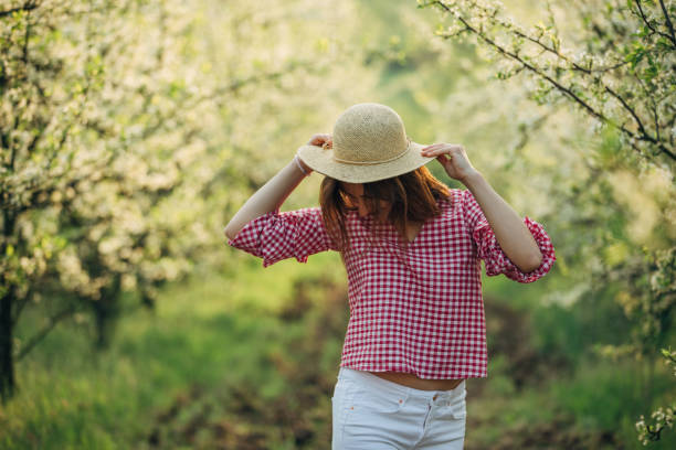 istock Beautiful woman in the orchard 1138667887