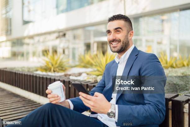 Handsome Businessman Working On The Go Stock Photo - Download Image Now - Adult, Adults Only, Beard