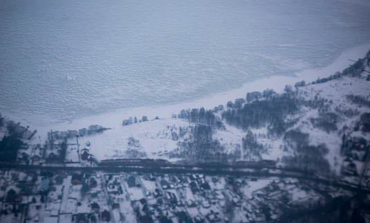 Moscow; Russia- March 08; 2019: View of the snow-covered suburbs of Moscow from an airplane
