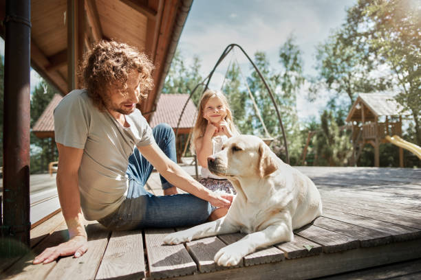 istock Father, daughter and dog 1138669527