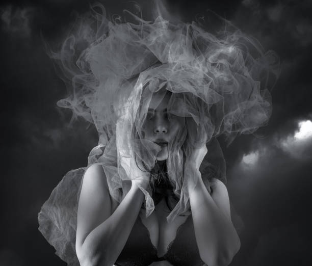 istock Young girl posing in smoking atmosphere 1138669864