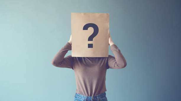 istock Young girl has Confused, Thinking, Question Mark Icon on Paper Bag 1138669945