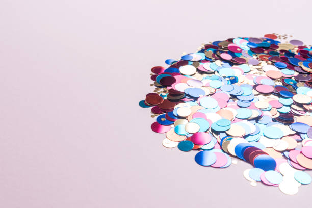 istock Colorful glitters on pink background. Creative minimal party concept. 1138670876