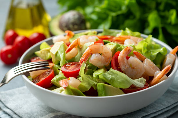 istock Salad with shrimps, avocado and cherry tomatoes. 1138671106