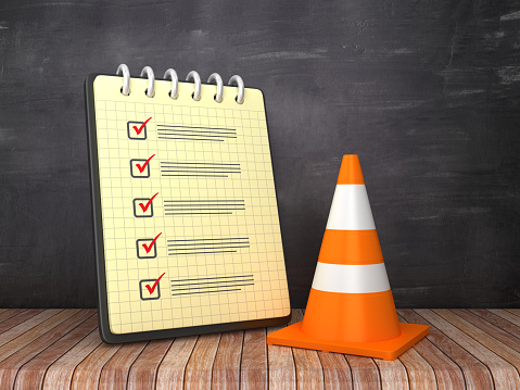Check List Note Pad with Traffic Cone on Chalkboard Background  - 3D Rendering