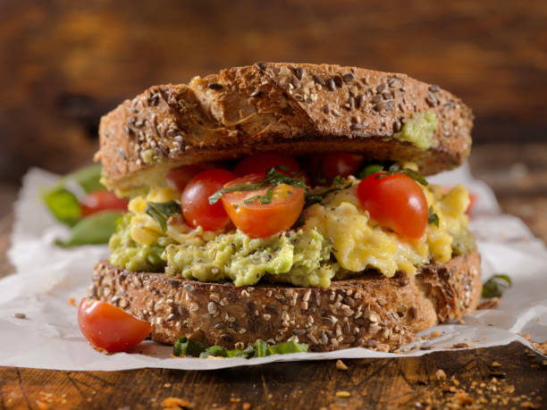 istock Creamy Avocado Sandwich with Scrambled Eggs and Tomatoes 1138671930