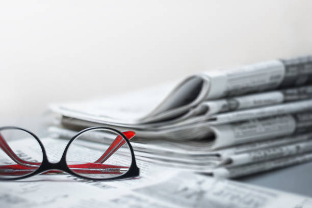 istock Newspapers on the desktop, eyeglasses. News concept 1138673362