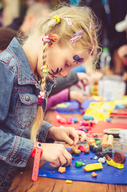 istock little lovely child playing with play dough 1138673396