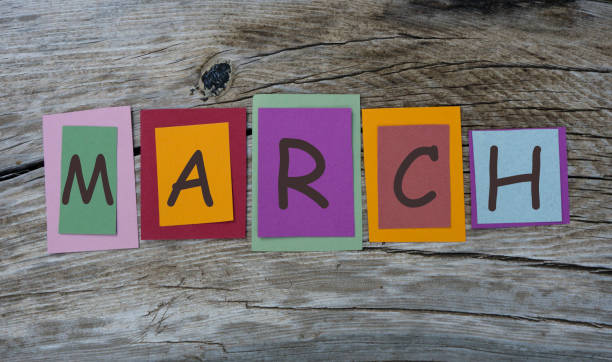 istock MARCH word written on colorful sticky notes on wooden background. 1138673555