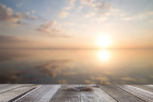 istock Empty woodeen table top and beautiful ocean at sunset. Summer background. 1138676312