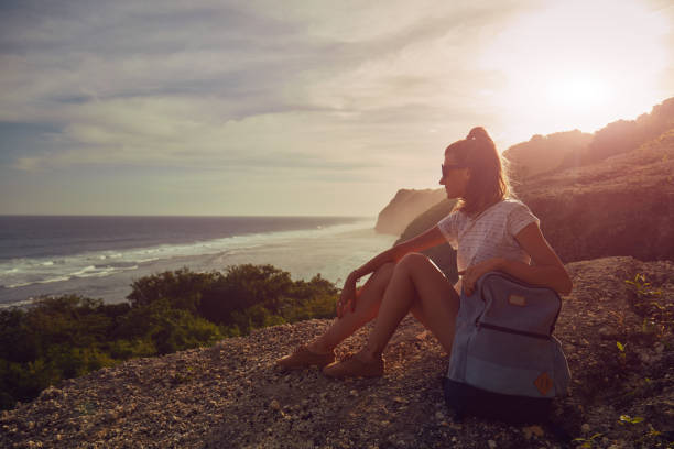 istock Tourist girl with backpack enjoying the view. 1138676623