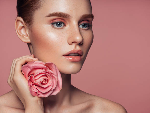 istock Beautiful woman with rose. Natural soft make-up. 1138676713