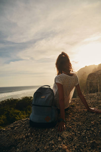 istock Tourist girl with backpack enjoying the view. 1138676759