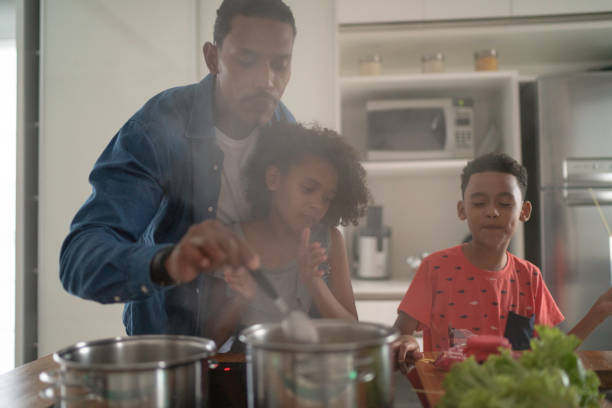 istock Family Cooking Together at Kitchen 1138677769