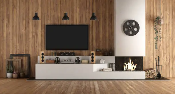 Home cinema in rustic style with fireplace and wooden paneling - 3d rendering
Note: the room does not exist in reality, Property model is not necessary
