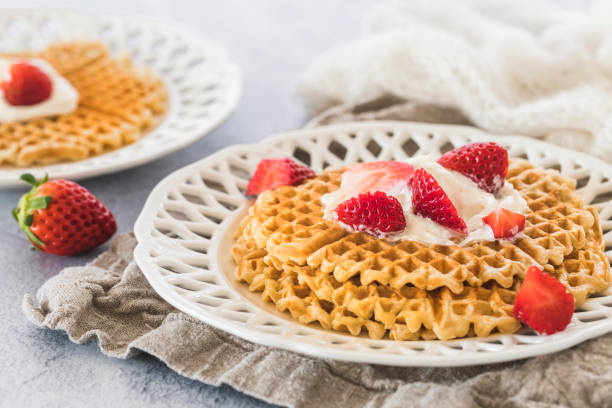 istock Waffles with strawberries and cream 1138679253