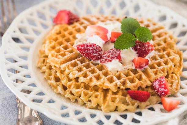 istock Waffles with strawberries and cream, close-up 1138680251