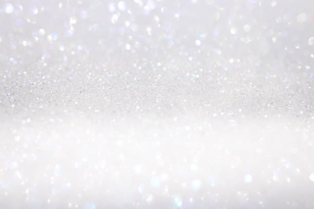 istock Photo white and silver glitter lights background 1138681473