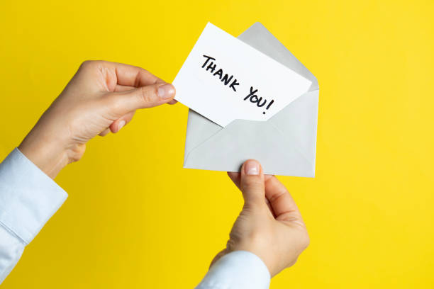 istock Woman with Thank You Card 1138681592