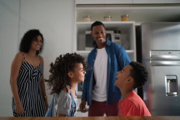 istock Latin family dancing together in the kitchen 1138683264