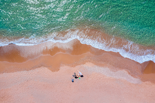 Aerial view of people camping on the beach
