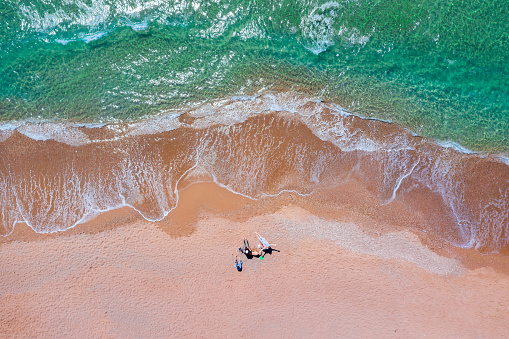 Aerial view of people camping on the beach