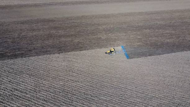 istock The tractor harrows the soil on the field for sowing 1138684402