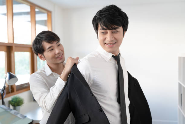 istock Young male couple getting dress 1138684974