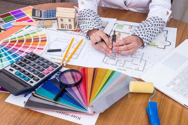 istock Female hands measuring on house plan in office 1138686508