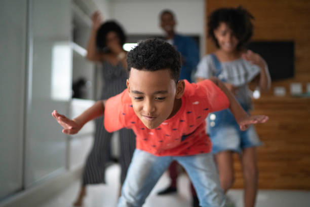 istock Latin family dancing together in the kitchen 1138686556