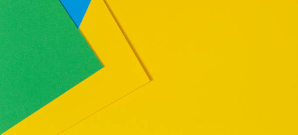 istock Geometric flat lay yellow green blue color paper background 1138686854