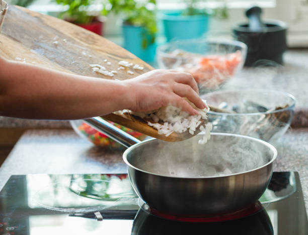 Young Woman Preparing Paella