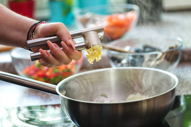 istock Young Woman Preparing Paella 1138688665