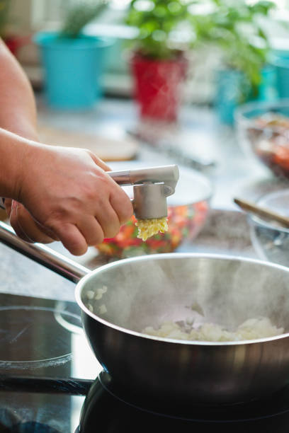 istock Young Woman Preparing Paella 1138689692