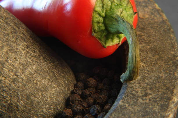 istock Simple Sushi dinner on white china on slate table. red chillis and crushed black pepper 1138690024