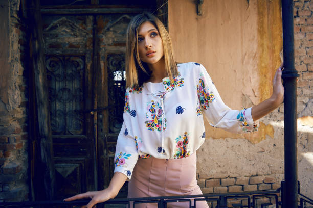 istock Young woman posing outdoors in colorful clothes 1138690418
